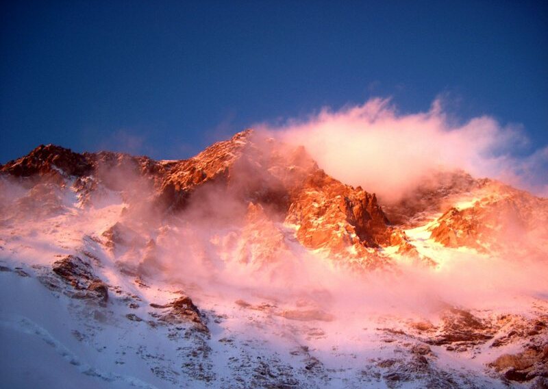 Snow-Capped Mountain and Sun Rays